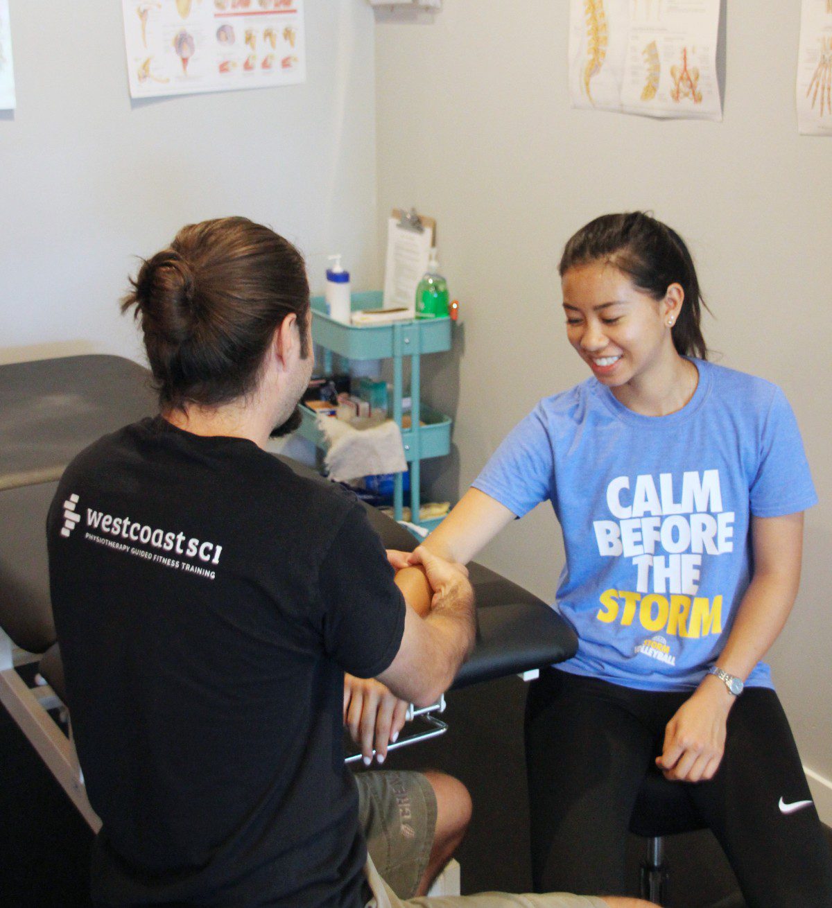 physiotherapist with client
