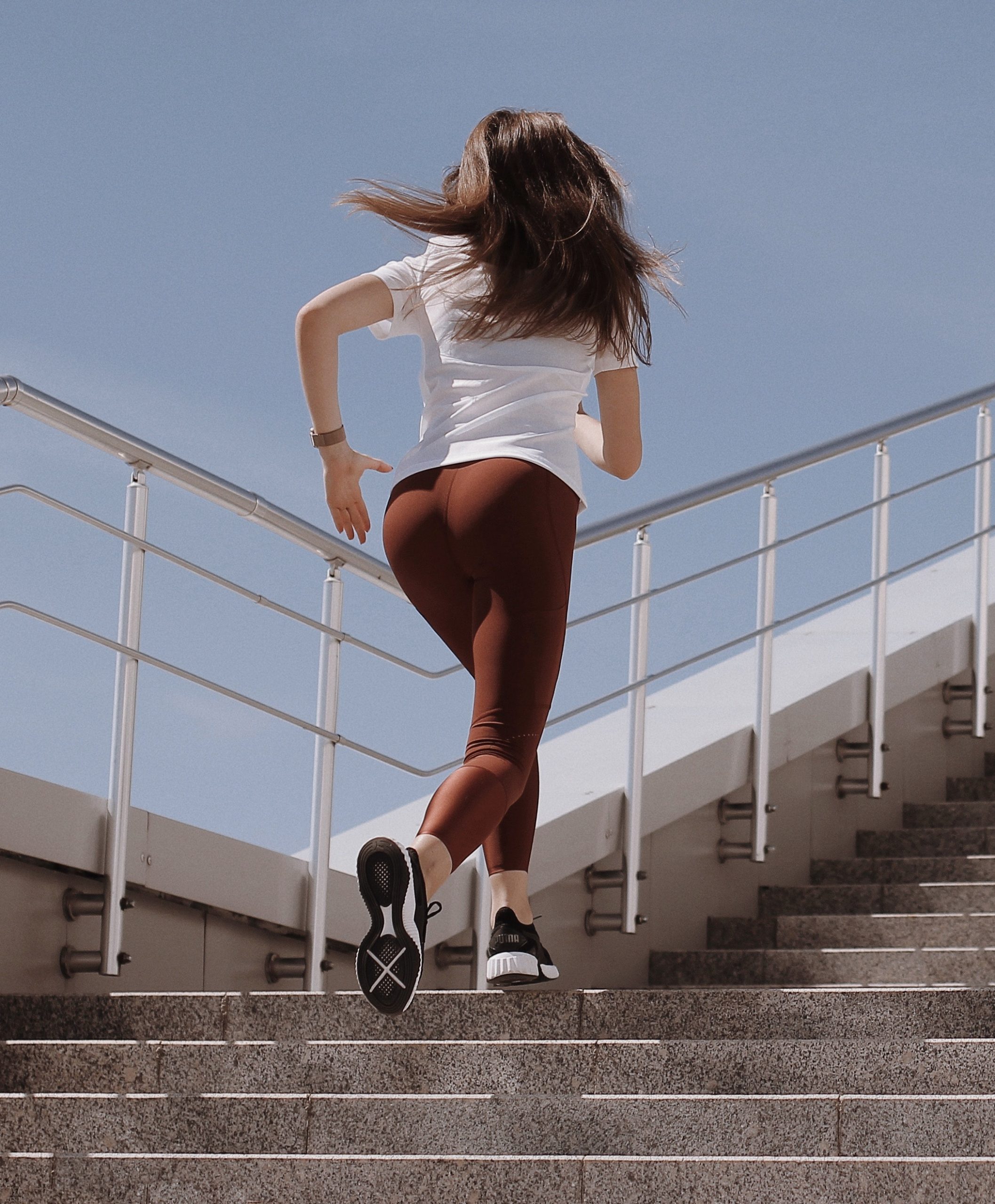 woman running up stairs